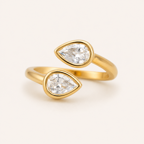 Adjustable ring for women with twin white teardrop stones and polished gold finish