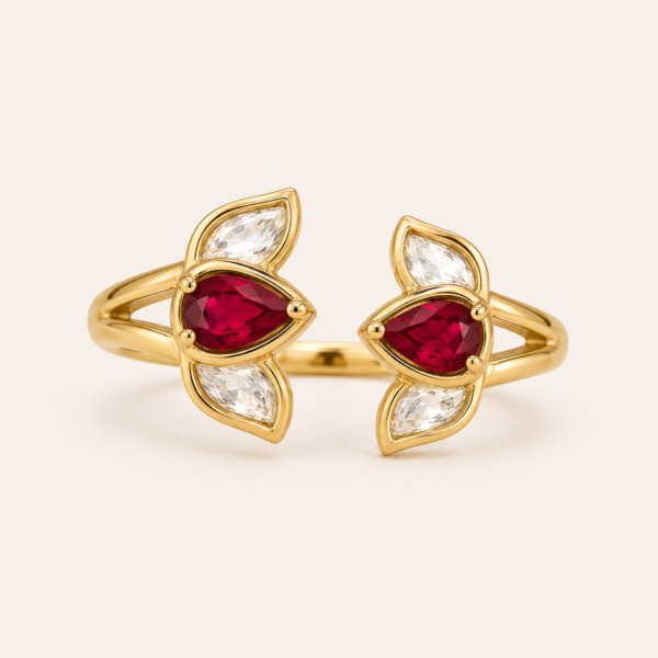 Adjustable red stone ring for women with pear-shaped stones, clear leaf accents and polished gold finish