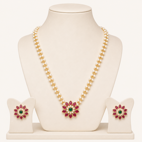Traditional necklace set for women with pearl strands, floral centrepiece and matching earrings