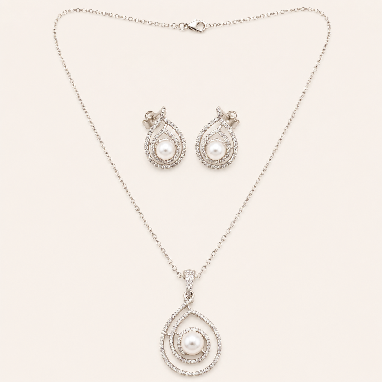 AD Pendant Set for Women | Pearl Teardrop Design AD pendant set for women with teardrop pearl pendant, silver finish chain and matching earrings