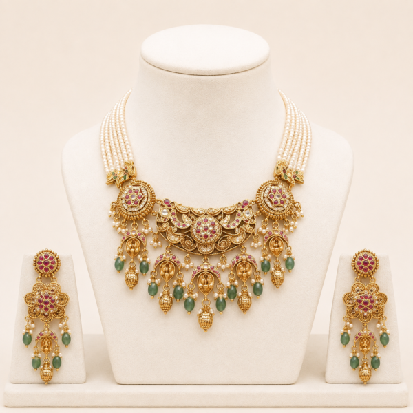 Traditional pearl necklace set for women with matching earrings displayed on a premium jewelry stand