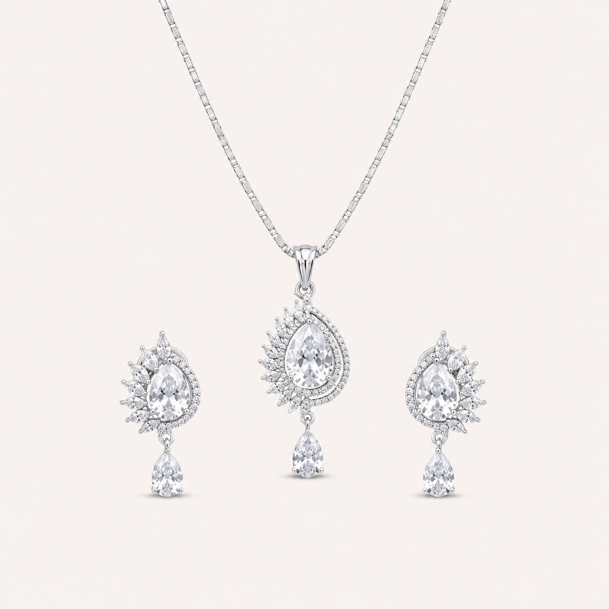 AD Pendant Set for Women | Radiant Teardrop | Party Wear AD pendant set for women with teardrop centre stone, delicate chain and matching drop earrings