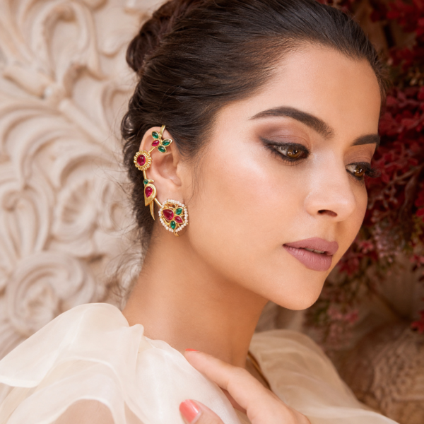 Statement ear cuff earrings with peacock, floral and leaf motifs framed by pearl-like accents