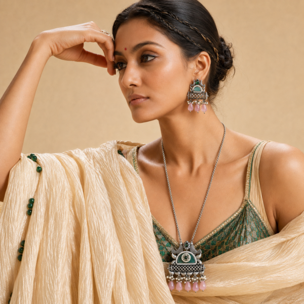Oxidised long necklace set with earrings featuring a peacock pendant, latticework and decorative drops
